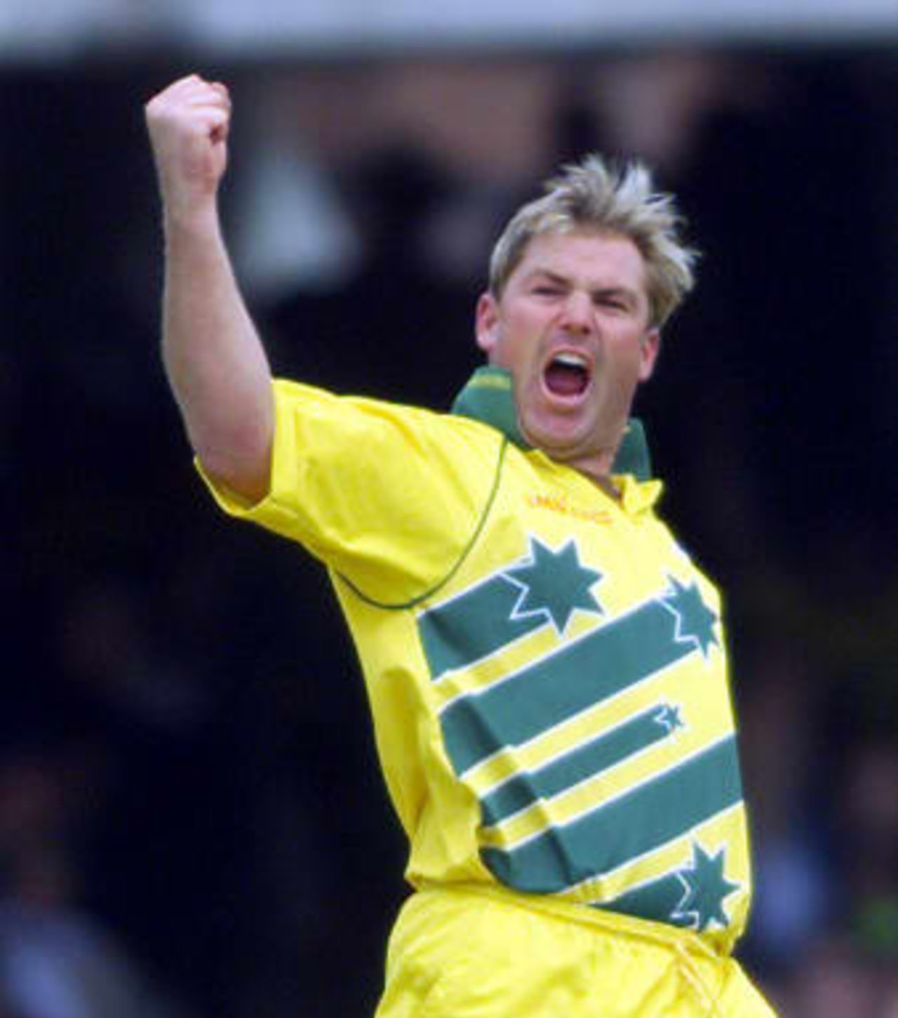 Shane Warne reacts after taking his third wicket that of Pakistan's Shahid Afridi 20 June 1999 during the Cricket World Cup final at Lords