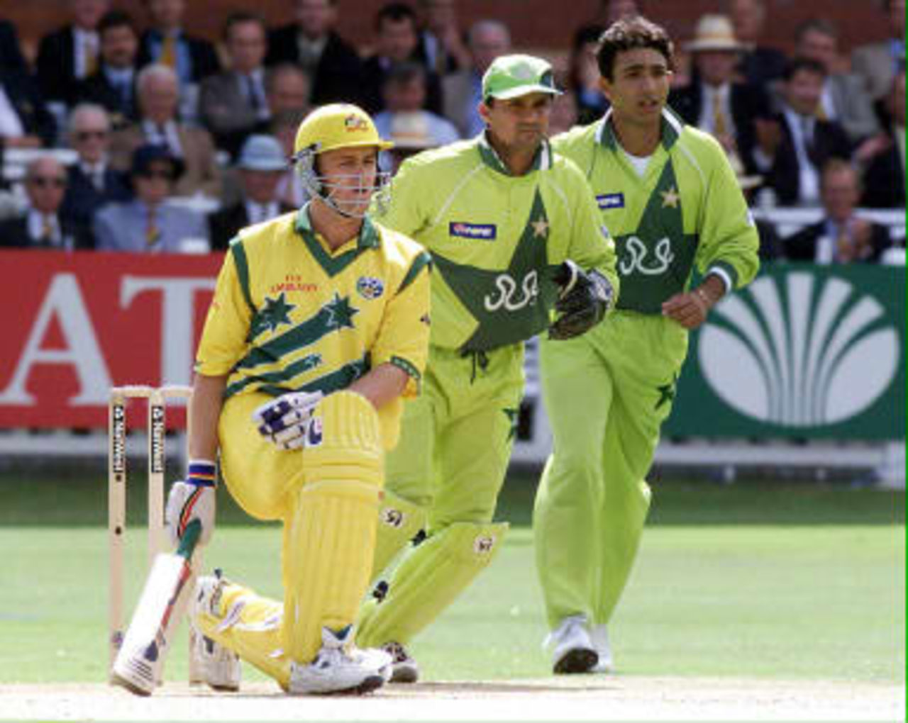 Australia's Adam Gilchrist (Left) stares in disbelief after being caught out by Pakistan`s Inzamam ul-Haq who injured his hand in the process during the World Cup cricket Final at Lords in London. Australia won by eight wickets. 20 June 1999.