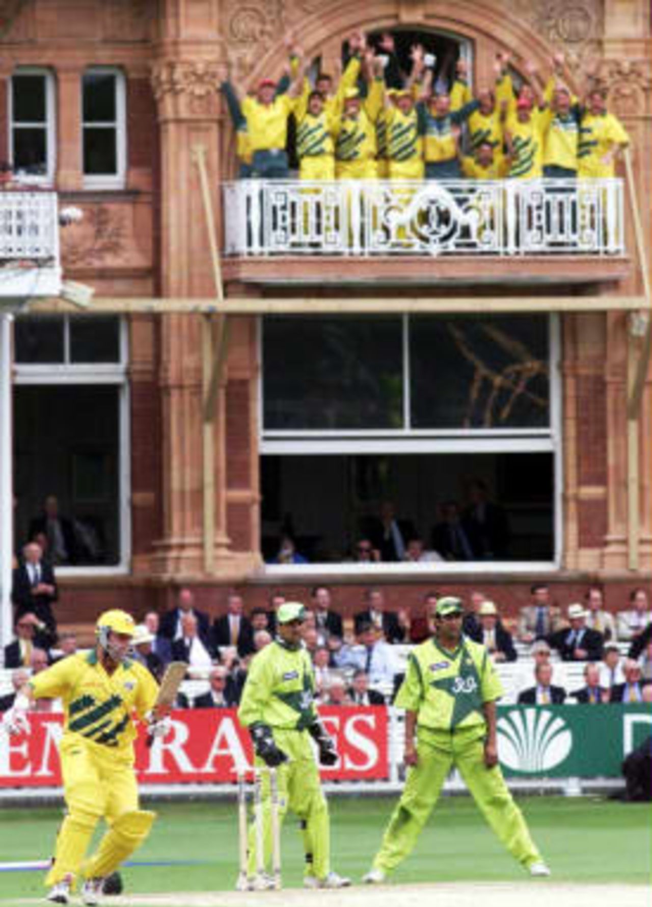 Australia`s cricket team celebrate from their dressing room balcony as the winning runs are scored against Pakistan in the World Cup final at Lords in London. Australia won by eight wickets. 20 June 1999.