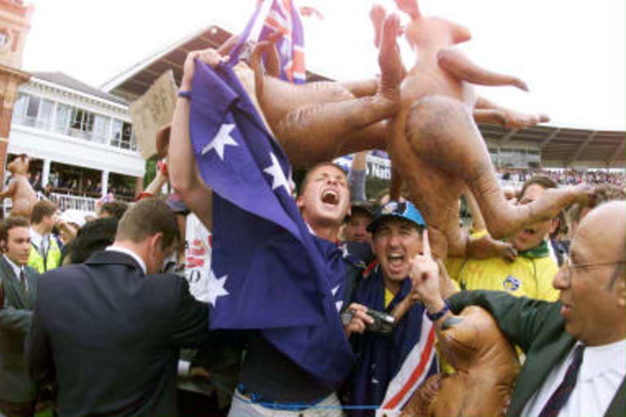 Lords security personnel hold back the victorious Australian cricket fans after their side defeafed Pakistan by eight wickets in the World Cup final, 20 June 1999.