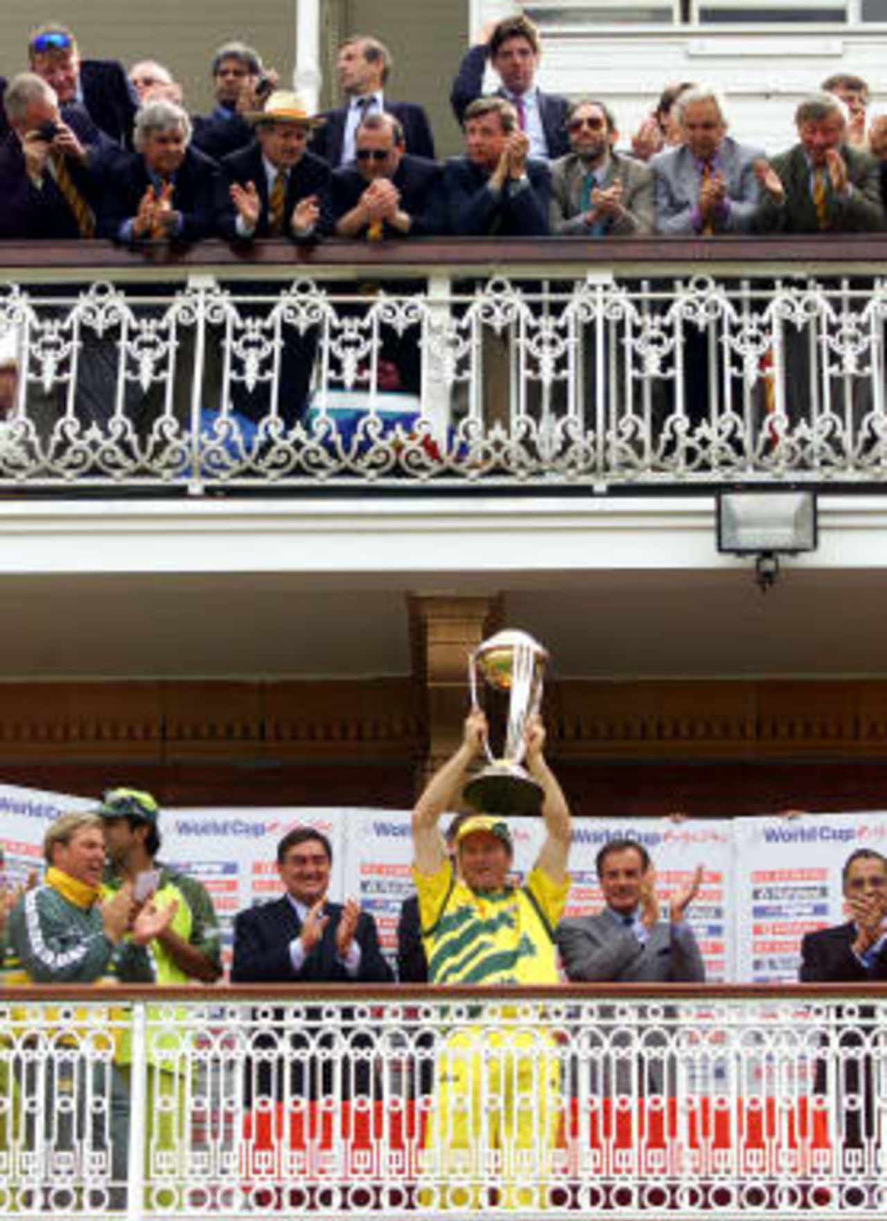 Australia's cricket captain Steve Waugh (Center) proudly presents the World Cup trophy on the balcony of Lords after Australia defeated Pakistan by 8 wickets at Lords in London, 20 June 1999.