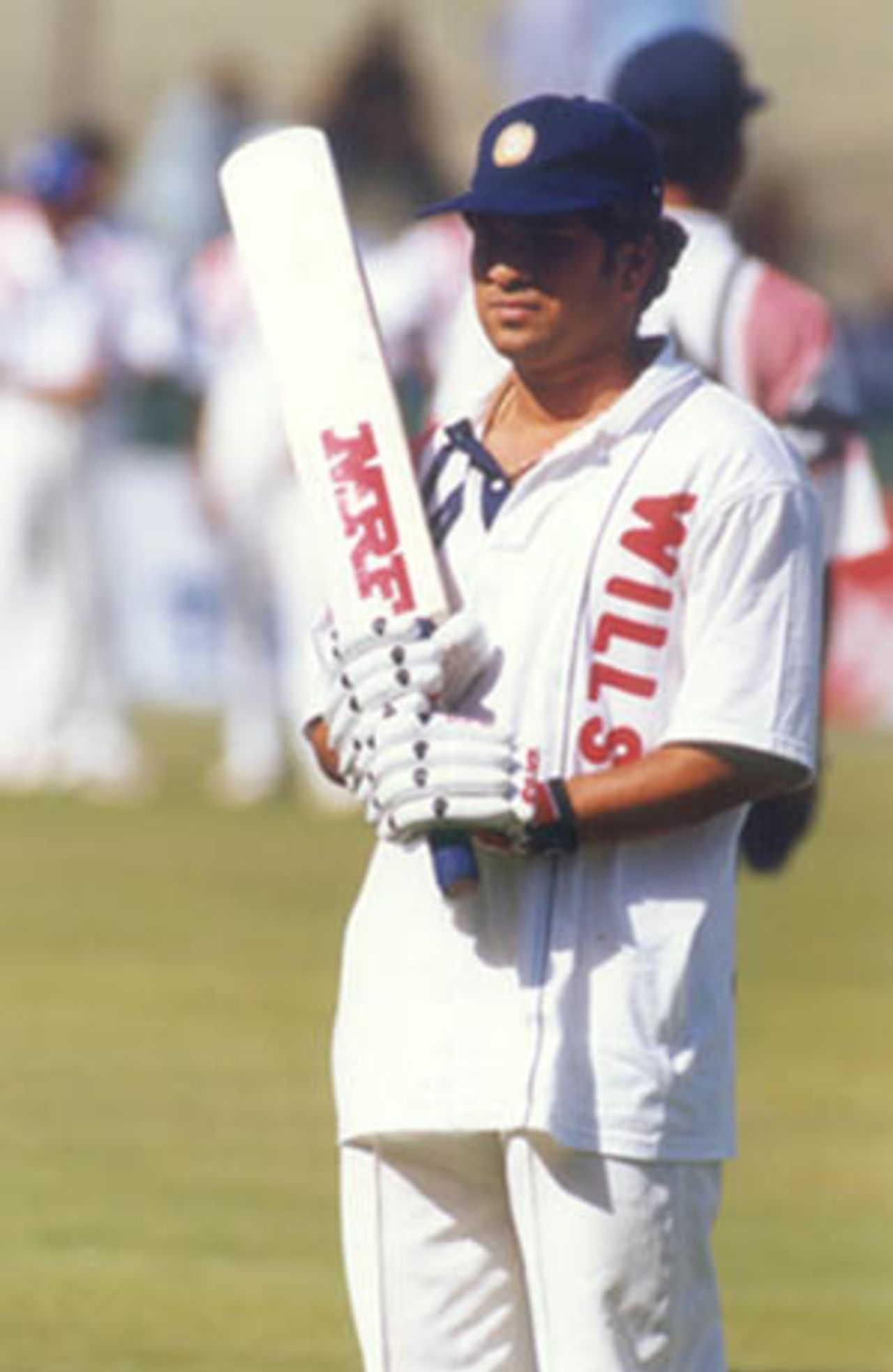 Waiting for his turn to get some batting practice at the nets