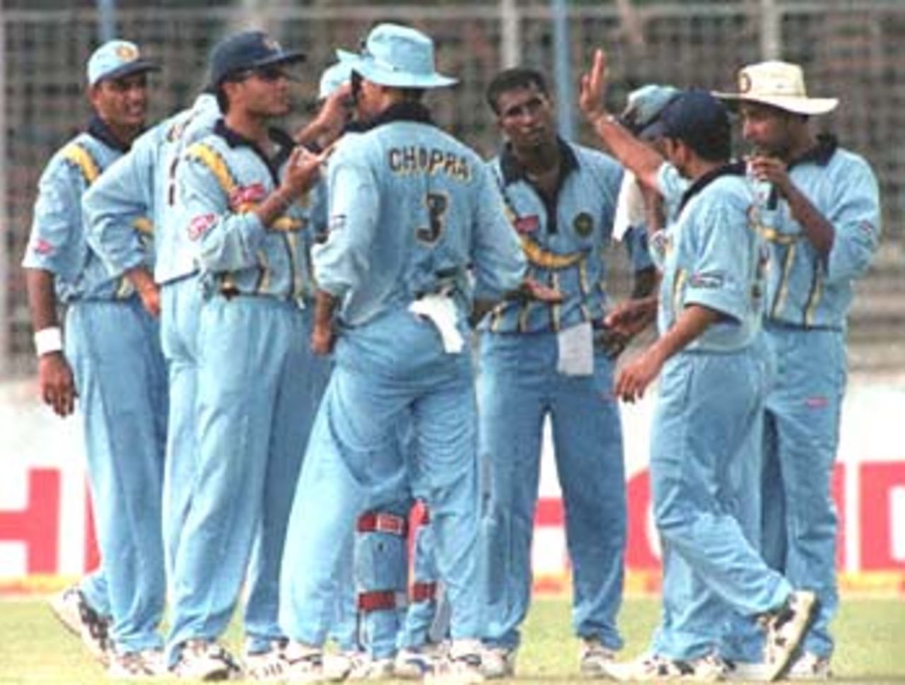 Indian players, including Sachin Tendulkar (2nd R), skipper Saurav Ganguly (2nd L) and former captain Mohammad Azharuddin (L), celebrate the fall of a Sri Lankan wicket during the four-nation Asia Cup limited-overs tournament at the Bangabandhu national stadium in Dhaka. India restricted Sri Lanka to 276-8. Asia Cup, 1999/00, 3rd Match, India v Sri Lanka, Bangabandhu National Stadium, Dhaka. 1 June 2000.