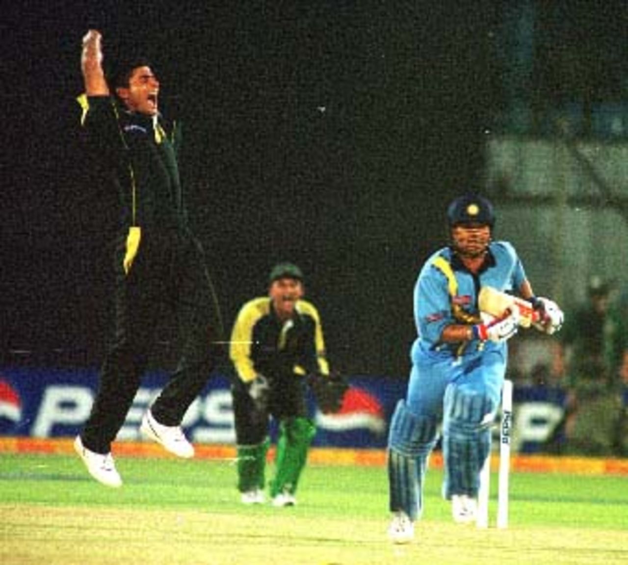 Abdur Razzaq jumps in joy after trapping Tendulkar LBW. Asia Cup, 1999/00, 5th Match, India v Pakistan, Bangabandhu National Stadium, Dhaka, 3 June 2000.