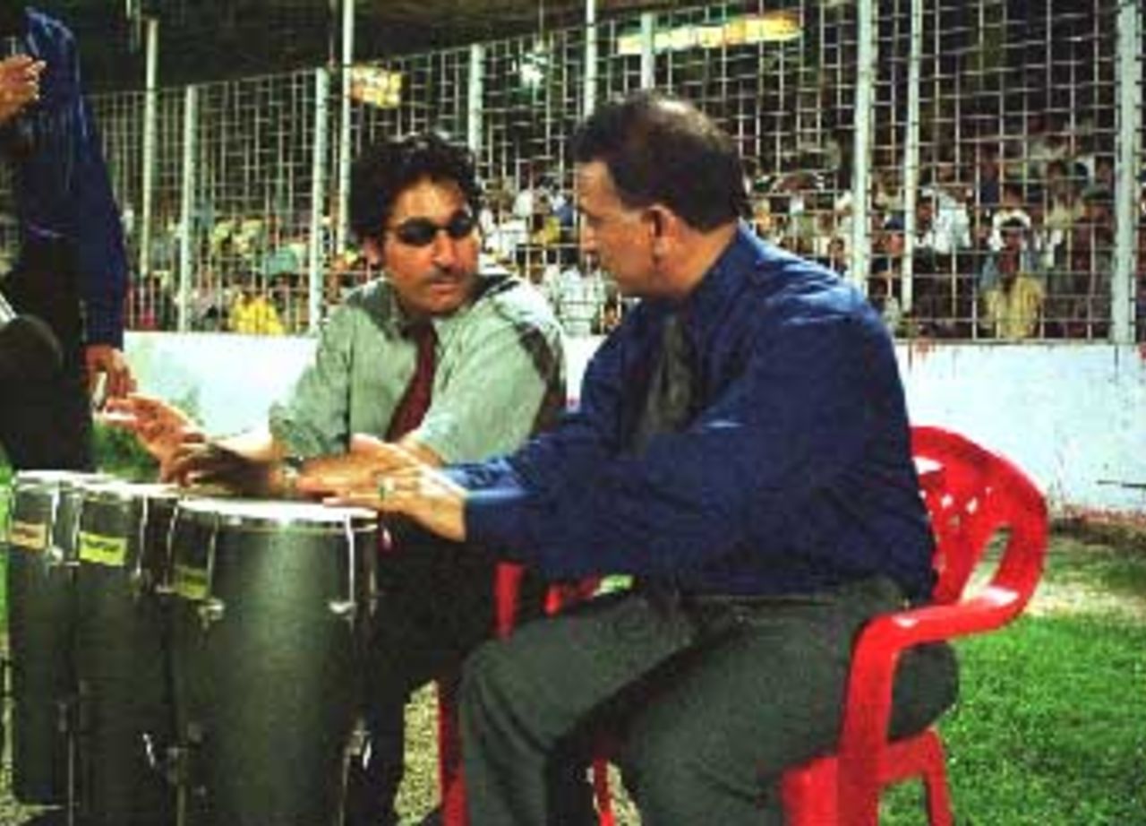 Commentators Sunil Gavaskar and Rameez Raja play the drums as they watch the match. Asia Cup, 1999/00, Dhaka.