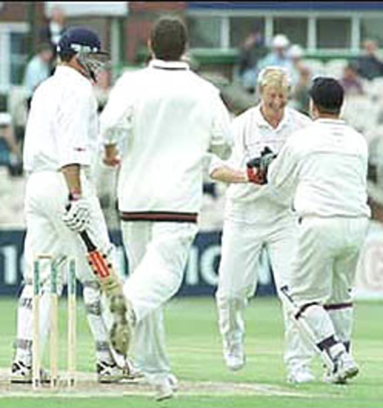Teammates rush to congratulate Chapple at the fall of Stubbings, PPP healthcare County Championship Division One, 2000, Lancashire v Derbyshire, Old Trafford, Manchester, 31MAY-03JUN2000.