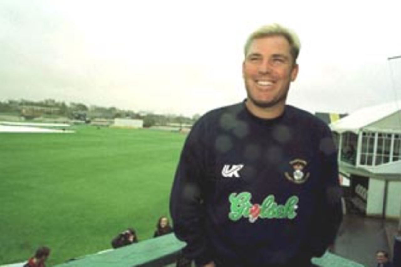 20 Apr 2000: Shane Warne of Hampshire finds something to smile about during the delayed wet weather start at Southampton before the Benson and Hedges Cup match against Kent.