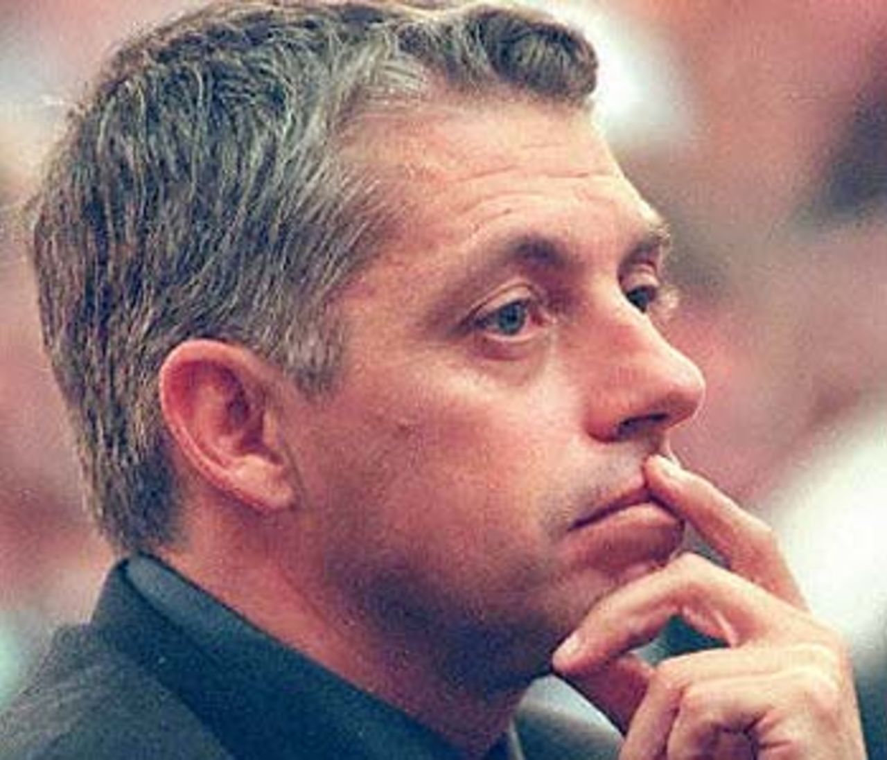 Retired South African wicketkeeper Dave Richardson looks contemplative prior to giving testimony at the King Commission of Inquiry into cricket match-fixing allegations in Cape Town 13 June 2000. Richardson confirmed a current foreign international cricketer, made a bribery offer to teammate Pat Symcox in India in 1996. Richardson told the King Commission into the Hansie Cronje scandal that he knew the identity of the player, but refused to name him.