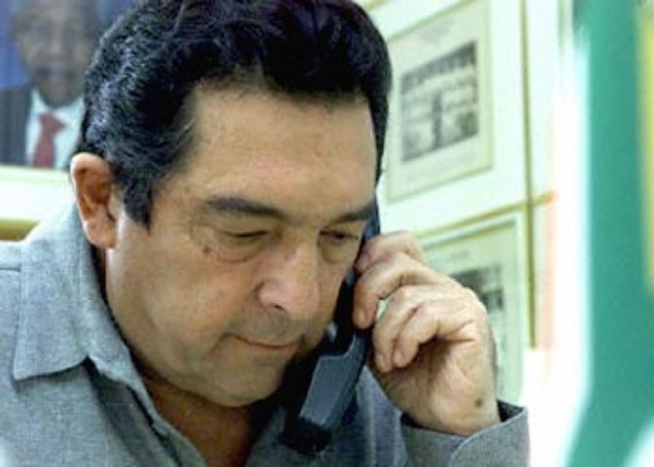 Ali Bacher, chief of South African United Cricket Board, speaks on the phone,14 June 2000, at his Johannesburg office. Allegations against Bacher of cricket match-fixing, brought forward by a Johannesburg lawyer, are being investigated by the king commission of inquiry into corruption in South African cricket.