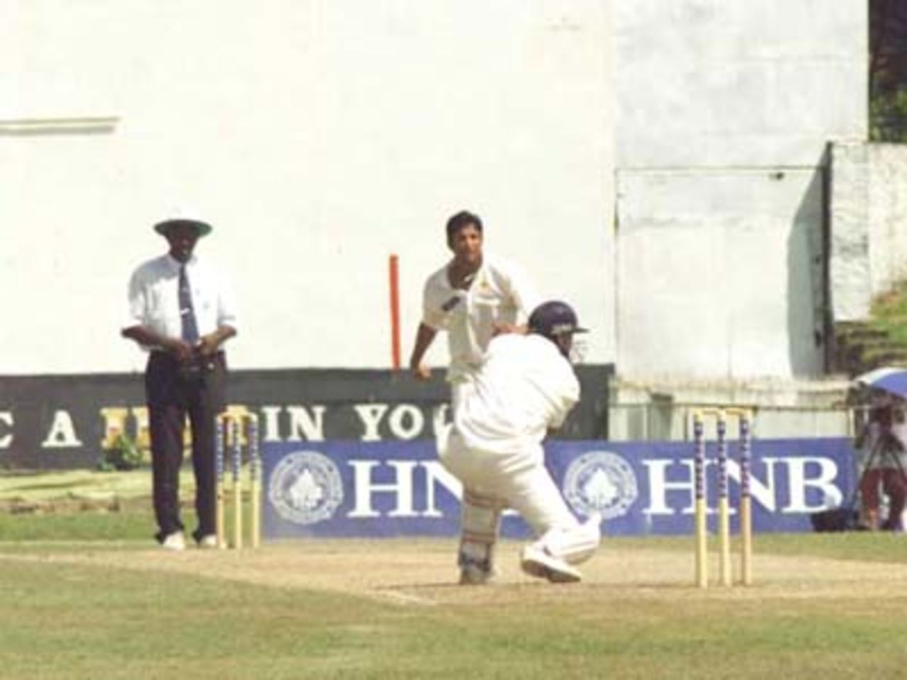 Murali square drives Wasim Akram on the second day of the First Test, 15 June, 2000. Pakistan in Sri Lanka, Sinhalese Sports Club Ground, Colombo, 14-18 June 2000