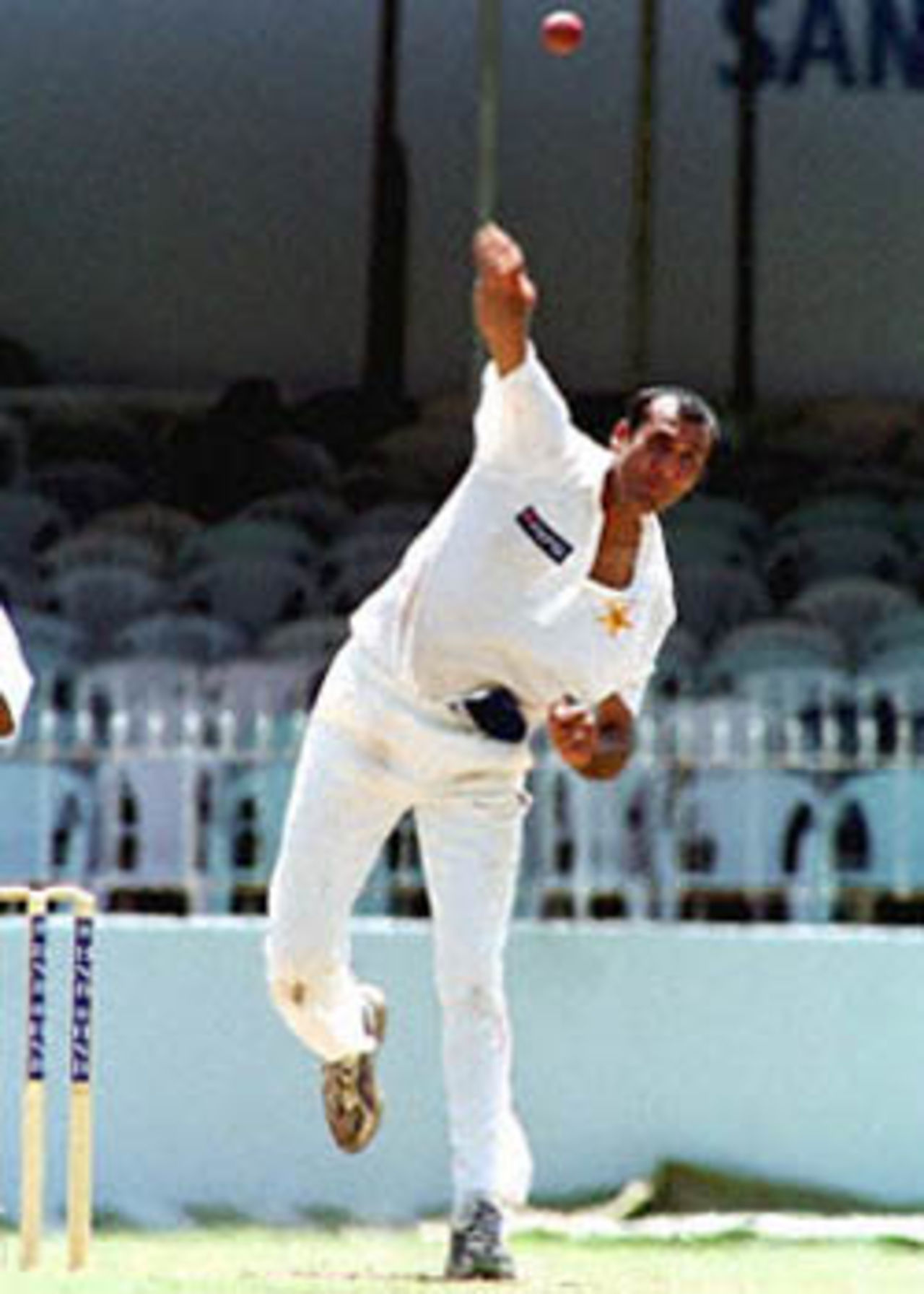 Pakistan spinner Arshad Khan sports matching shoes as he delivers; 15 June 2000 in the first test against Sri Lanka here in the capital Colombo. Khan bagged four wickets for 62 runs. Pakistan in Sri Lanka, 1999/00, 1st Test, Sri Lanka v Pakistan, Sinhalese Sports Club Ground, Colombo, 14-18 June 2000 (Day 2).