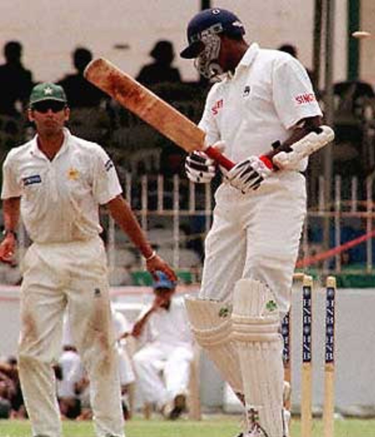 Sri Lanka's RD Fernando looks back as his bails fly off the bowling of Pakistan's Wasim Akram on the fourth day of their first Test at the Sinhalese sports club grounds in the Sri Lankan capital. Pakistan won by five wickets with a full day's play left and Akram (not in the picture) was named man of the match. Pakistan in Sri Lanka, 1999/00, 1st Test, Sri Lanka v Pakistan, Sinhalese Sports Club Ground, Colombo 14-18 June 2000 (Day 4).
