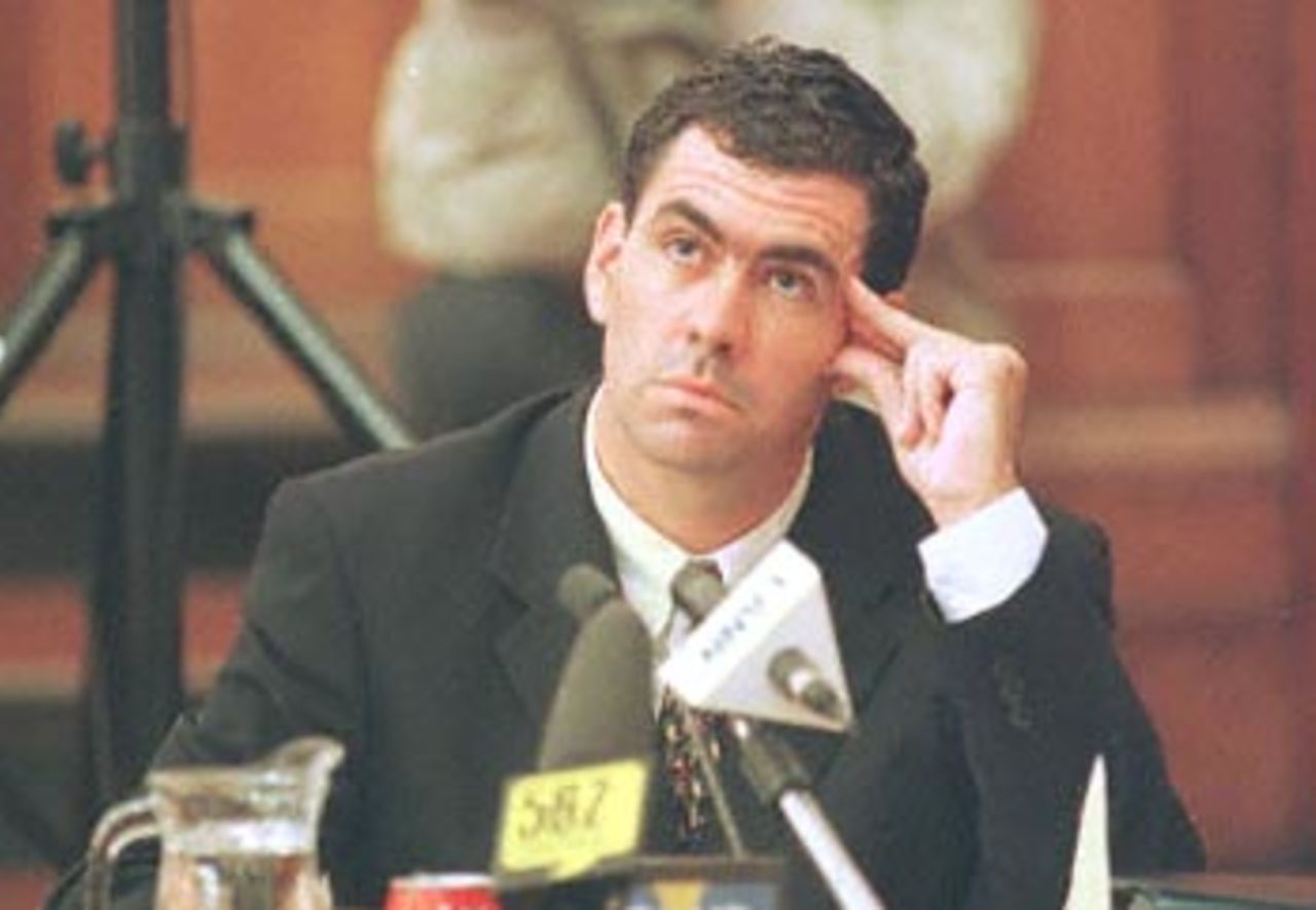 Sacked South African cricket captain Hansie Cronje ponders a point during his cross-examination at the King Commission of Inquiry into allegations of cricket match-fixing in Cape Town 22 June 2000. Cronje refused to name players who might have been in favour of accepting a 200,000 dollars bribe in 1996 to throw a one-day international in India.