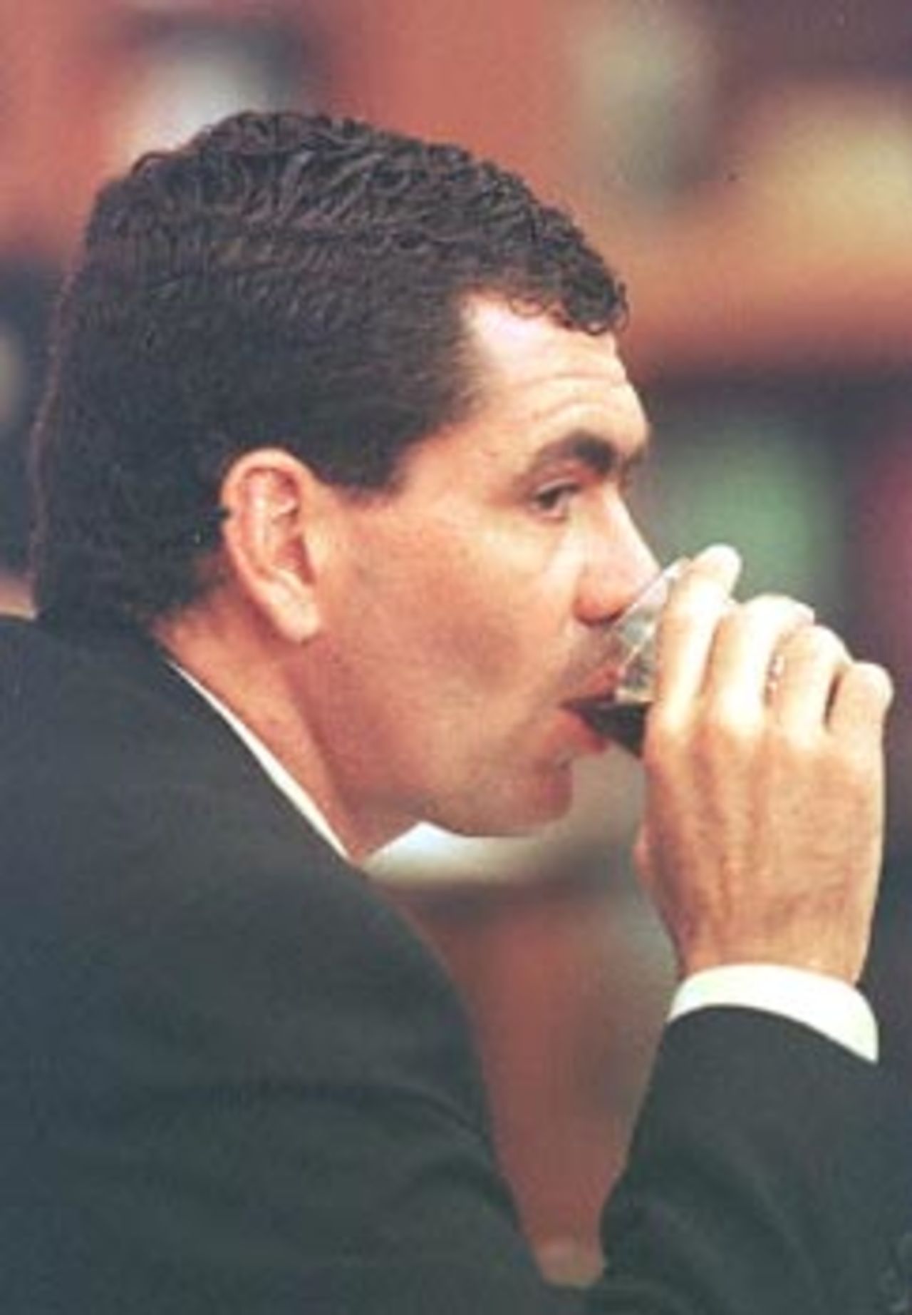 Sacked South African cricket captain Hansie Cronje drinks a glass of water during his cross-examination at the King Commission of Inquiry into allegations of cricket match-fixing in Cape Town 22 June 2000. Cronje refused to name players who might have been in favour of accepting a 200,000 dollars bribe in 1996 to throw a one-day international in India.
