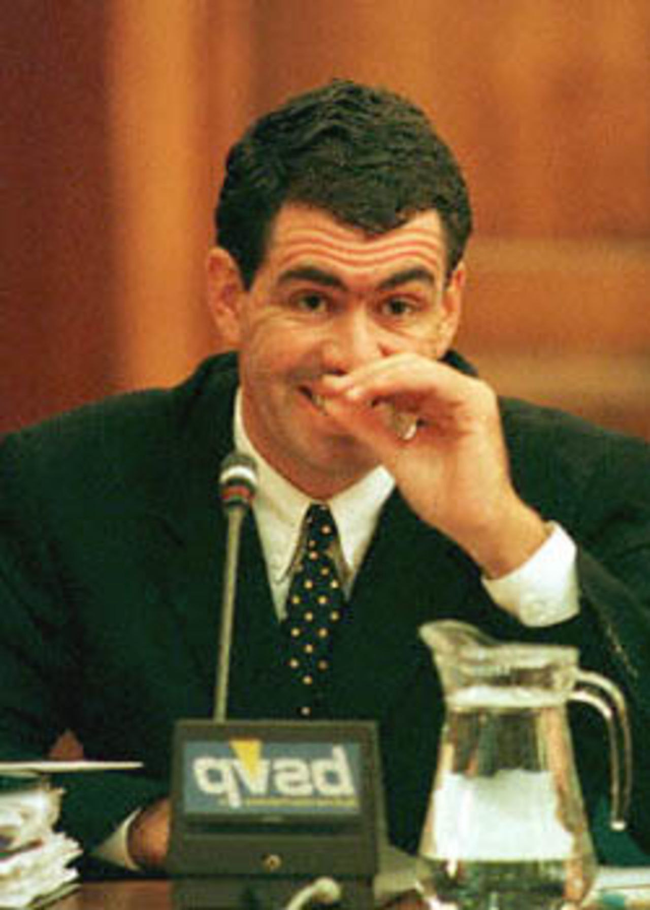 Former South African cricket captain Hansie Cronje grimaces during his cross-examination at the King Commission of Inquiry into allegations of cricket match-fixing in Cape Town 23 June 2000. Cronje and his legal team became embroiled in a dispute yesterday over the validity of transcripts released by Indian police during the sacked South African captain's cross examination at the King commission.