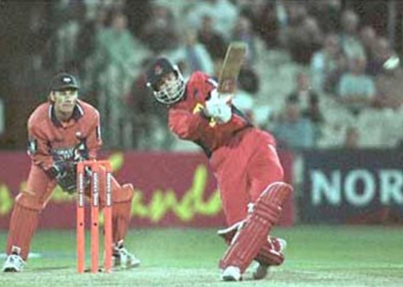 John Crawley dancing down the track to cart the ball over the bowlers head, National League Division One, 2000, Lancashire v Yorkshire, Old Trafford, Manchester, 27 June 2000.