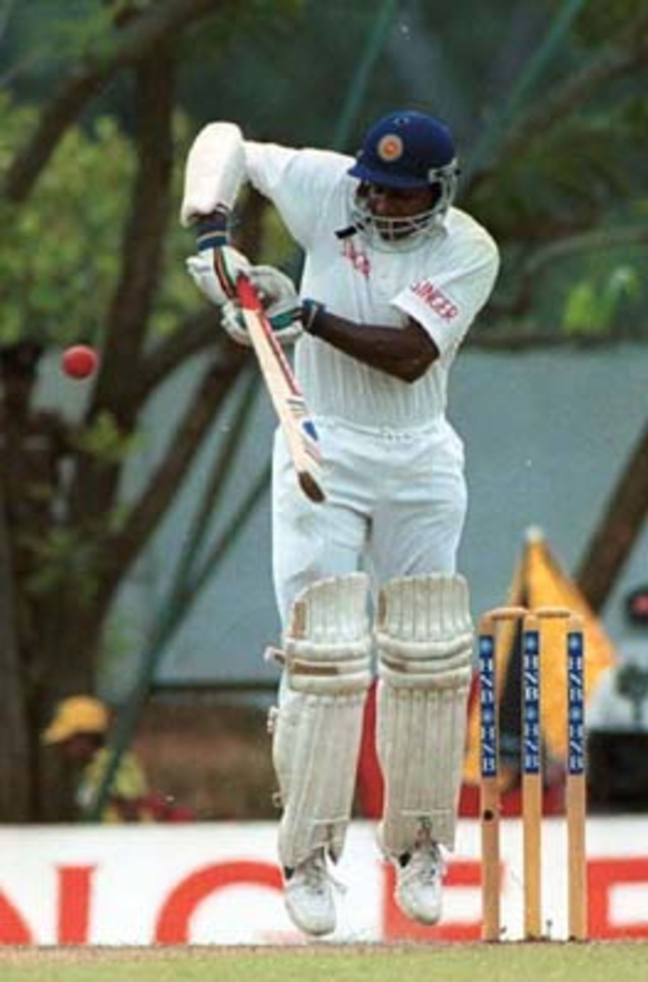 Sri Lankan batsman Sanath Jayasuriya drives the ball for four runs during the first day of the third cricket Test against Pakistan in Asgiriya International cricket stadium in Kandy, Sri Lanka on Wednesday, June. 28, 2000. Jayasuriya was unbeaten on 82 at the end of the day's play as Sri Lanka scored 140 runs without loosing any wicket
