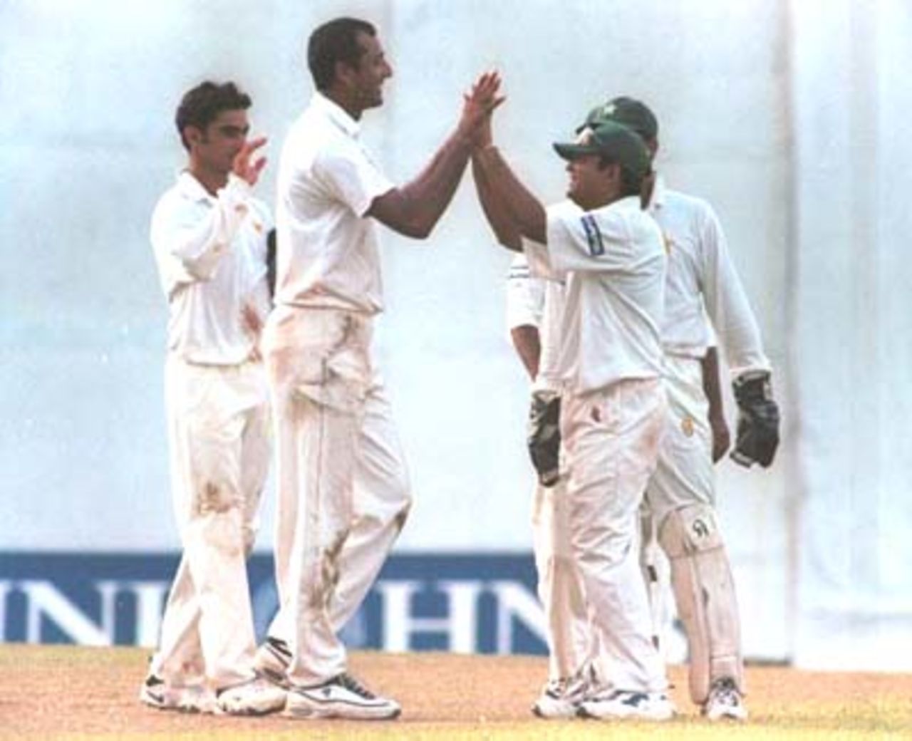Pakstani bowler Arshad Khan celebrates with teammates during the second day of the third cricket Test against Pakistan in Asgiriya International cricket stadium in Kandy, Sri Lanka on Thursday, June. 29, 2000