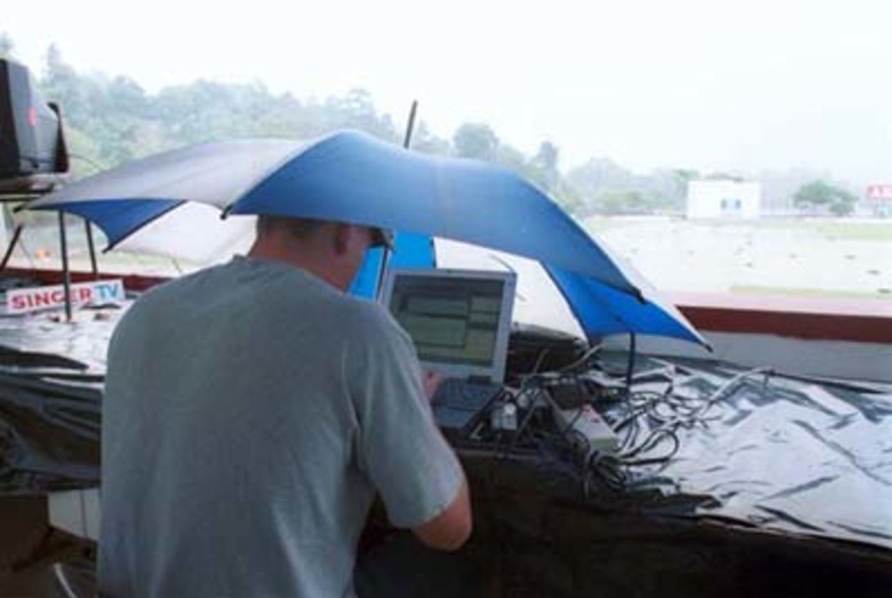 Charlee at work!!! as ground staff collect water from covers during the third day of the third cricket Test between Sri Lanka and Pakistan in Asgiriya International cricket stadium in Kandy, Sri Lanka on Friday, June. 30, 2000