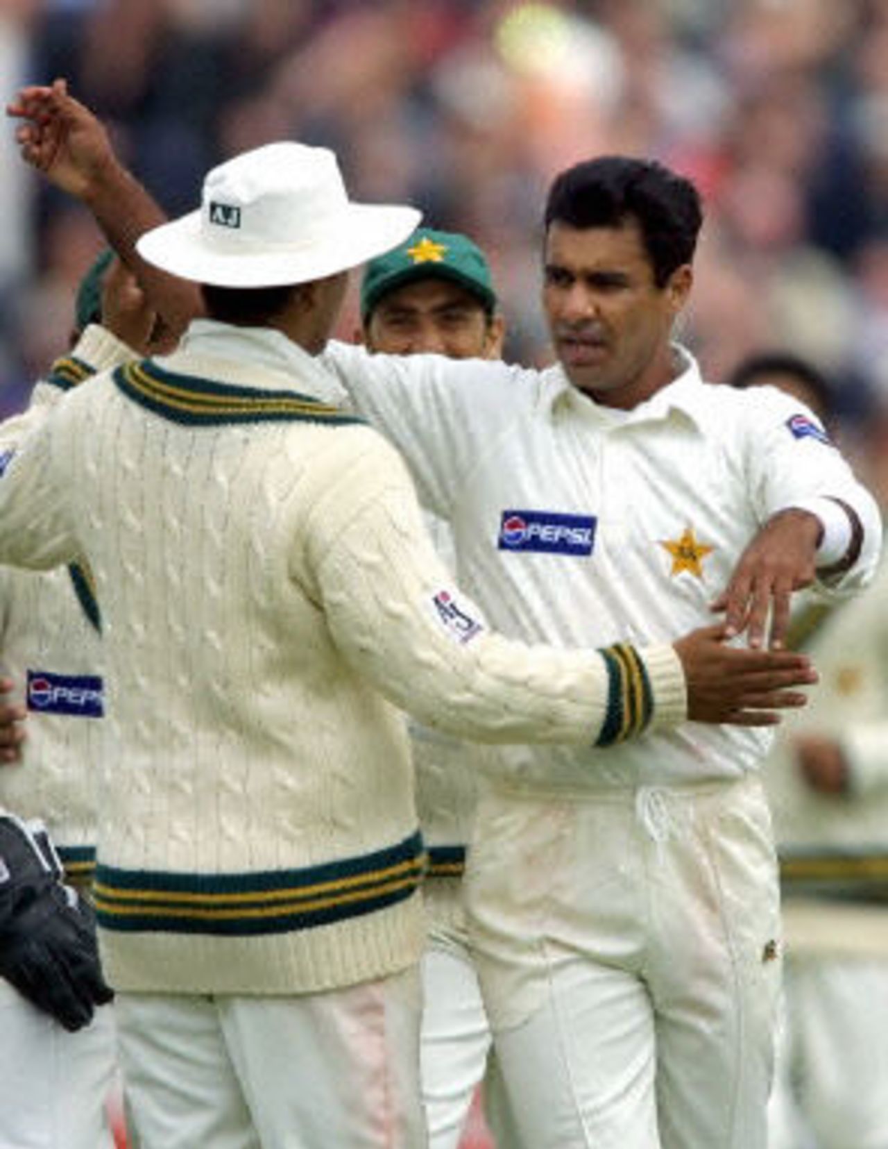 Waqar Younis and teammates celebrate running out Michael Vaughan, day 3, 2nd Test at Old Trafford, 17-21 May 2001.
