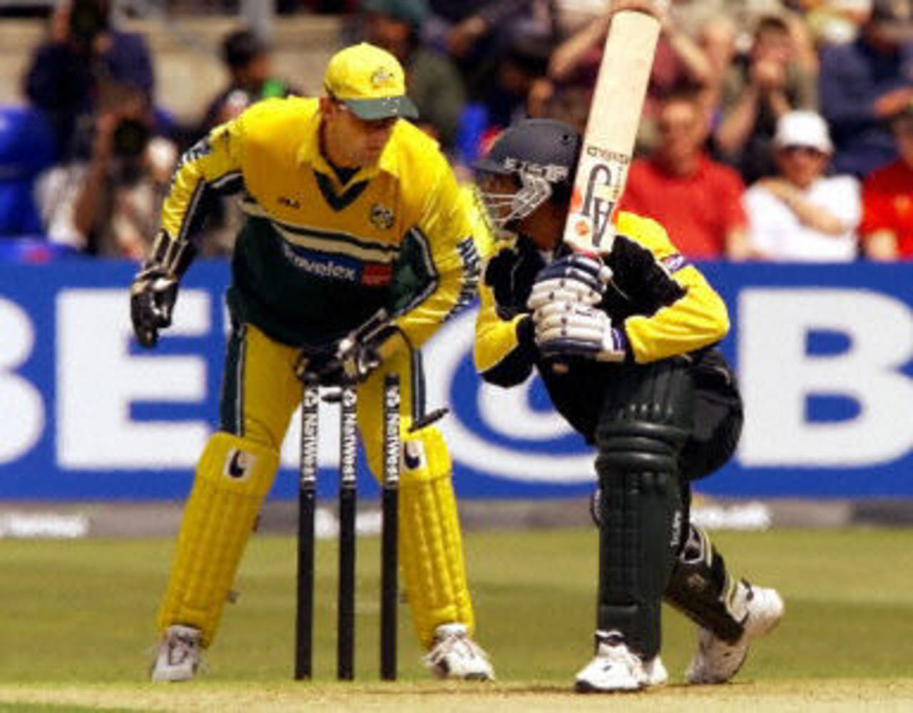 Rashid Latif keeps his ground as Adam Gilchrist takes the bails off, 2nd ODI at Cardiff, 9 June 2001.