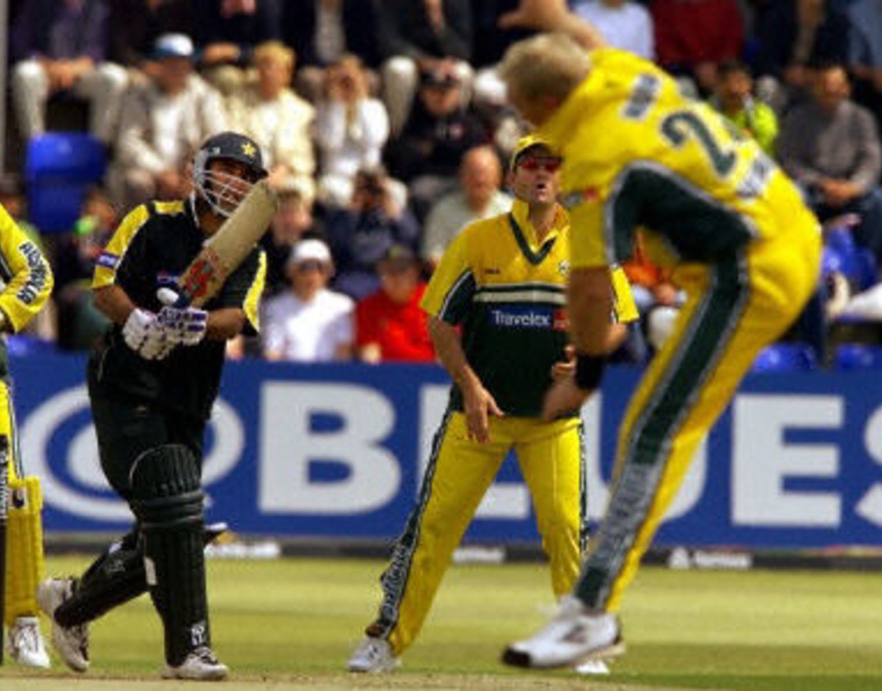 Saeed Anwar drives back past diving Shane Warne as Mark Waugh looks on, 2nd ODI at Cardiff, 9 June 2001.