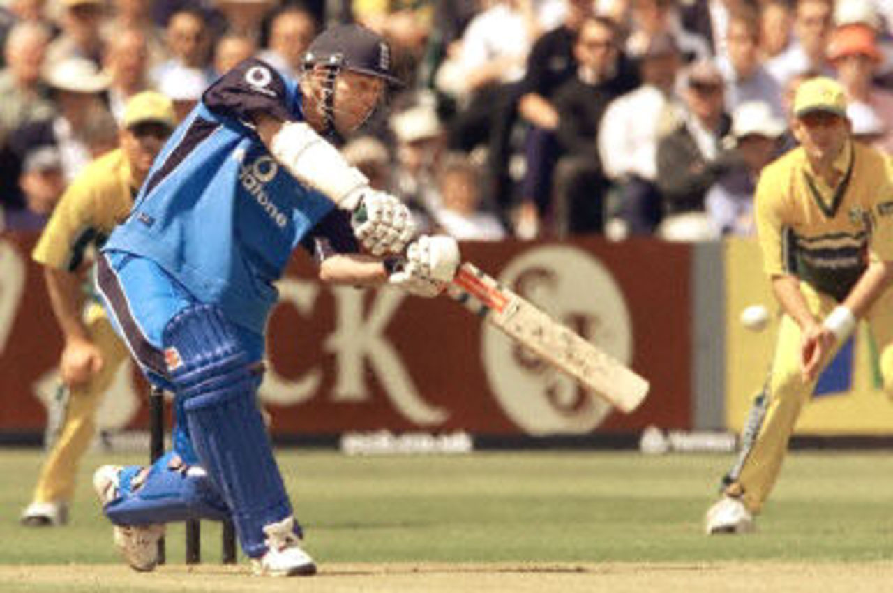 Nick Knight dances down the wicket cracking a delivery over covers for four runs, 3rd ODI at Bristol, 10 June 2001.