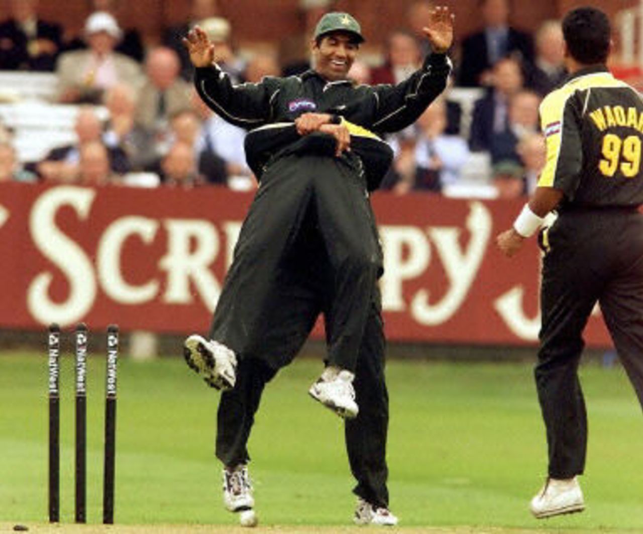 Yousuf Youhana is hoisted by a team-mate after running out Cork as Waqar Younis joins in, 4th ODI at Lords, 12 June 2001.