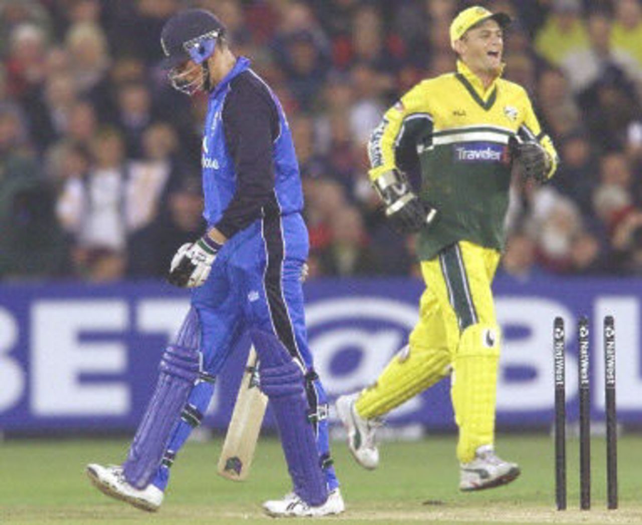 Marcus Trescothick looks dejected after been bowled by Glenn McGrath as Adam Gilchrist celebrates, 5th ODI at Old Trafford,14 June 2001.
