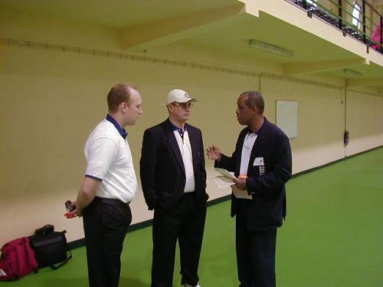 John Holder (right) briefing other umpires at the Indoor Tournament
