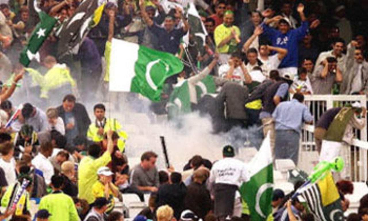 Fireworks explode amongst Pakistani fans prompting Steve Waugh to lead his team off the field, 8th ODI at Trent Bridge, 19 June 2001.