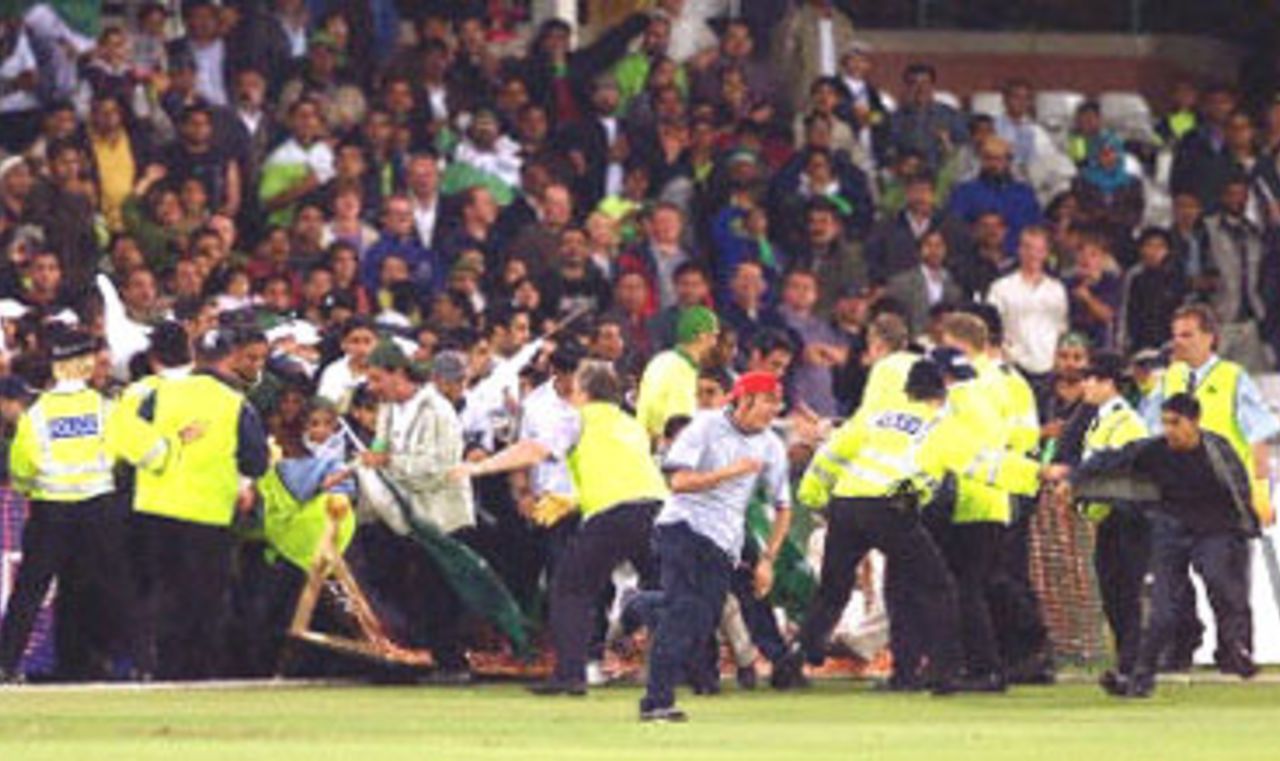 Pakistani fans burst through the lines of police and stewards after Pakistan defeated Australia, 8th ODI at Trent Bridge, 19 June 2001.