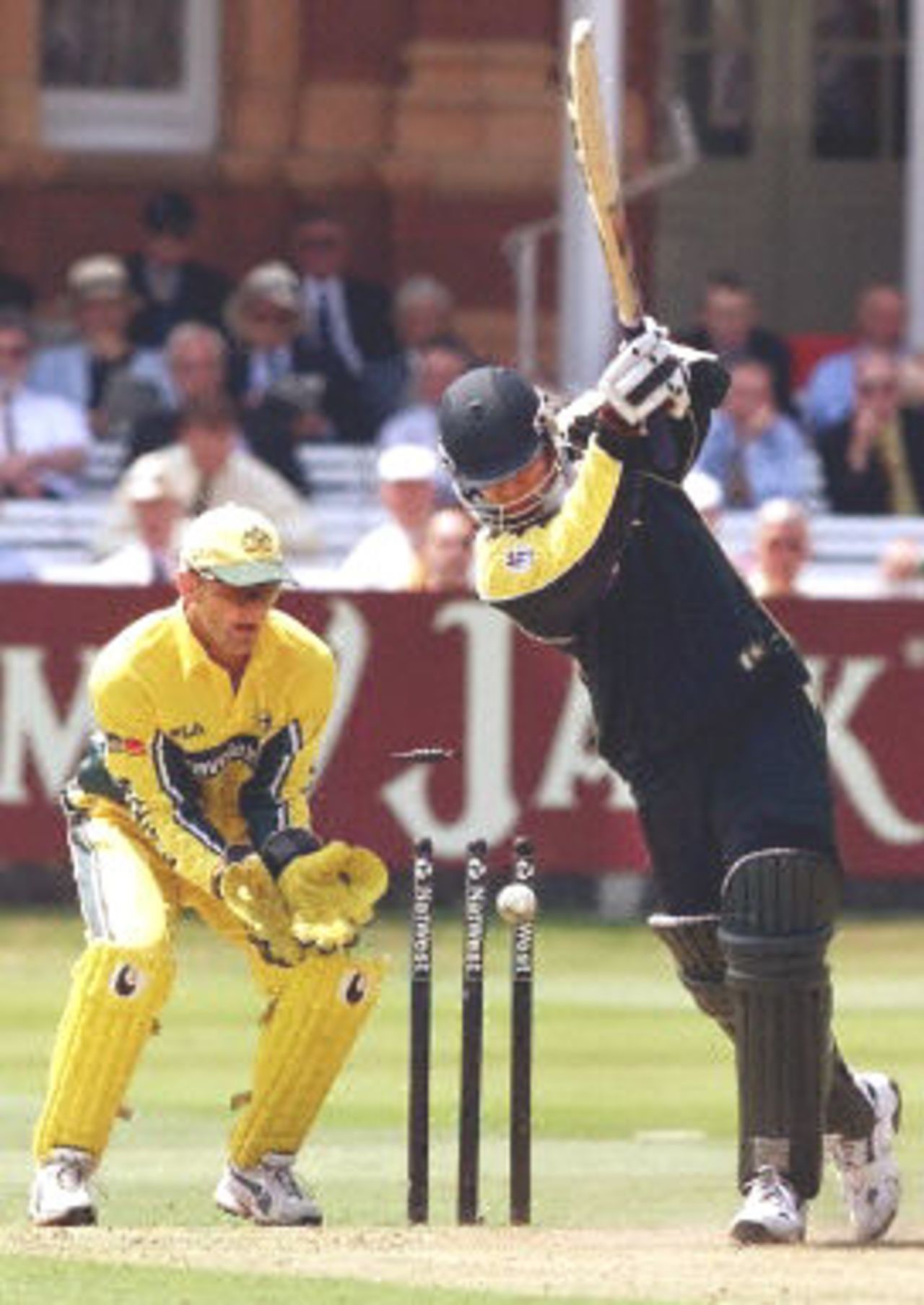 Azhar Mahmood plays all around a Shane Warne delivery and is bowled as Adam Gilchrist looks on, final ODI at Lords, 23 June 2001.