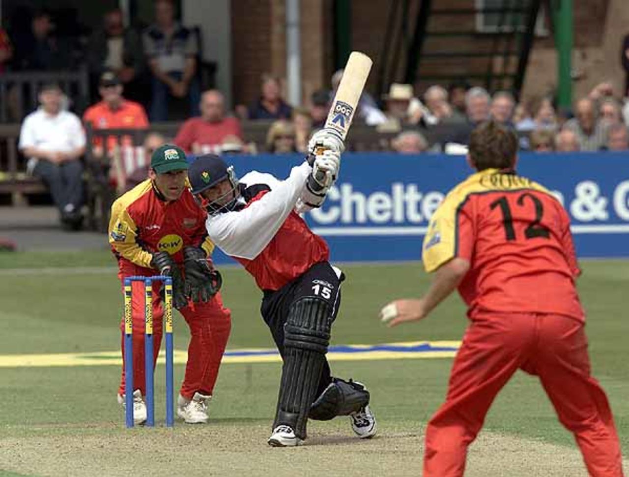 Steve James drives Carl Crowe for four, as wicket keeper Neil Burns watches,during the Norwich Union League match between Leicestershire and Glamorgan at Leicester, 4 May 2002