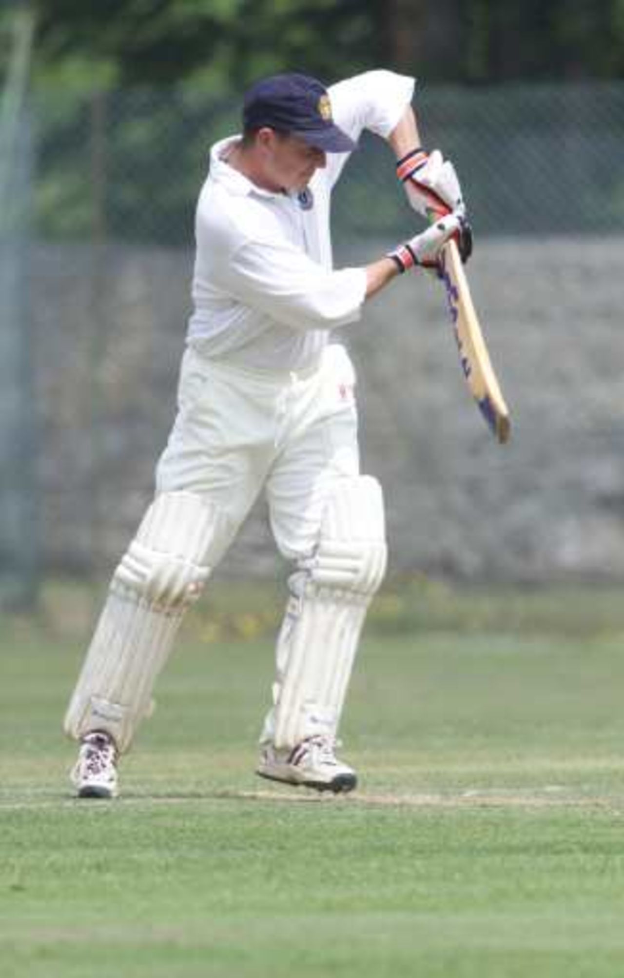 Daniel Peacock of Lymington CC and Zimbabwe playes a defensive shot