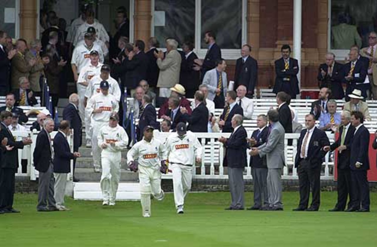 The Warwickshire team emerge from the Lord's Pavilion for the final final of the Benson and Hedges Trophy, 22 June 2002