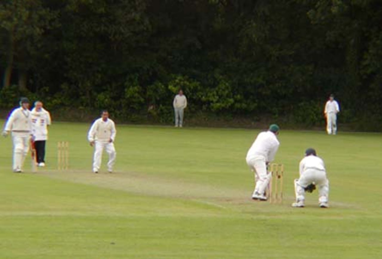 Rajesh Maru of Portsmouth CC bowling in the SPCL at Calmore Sports