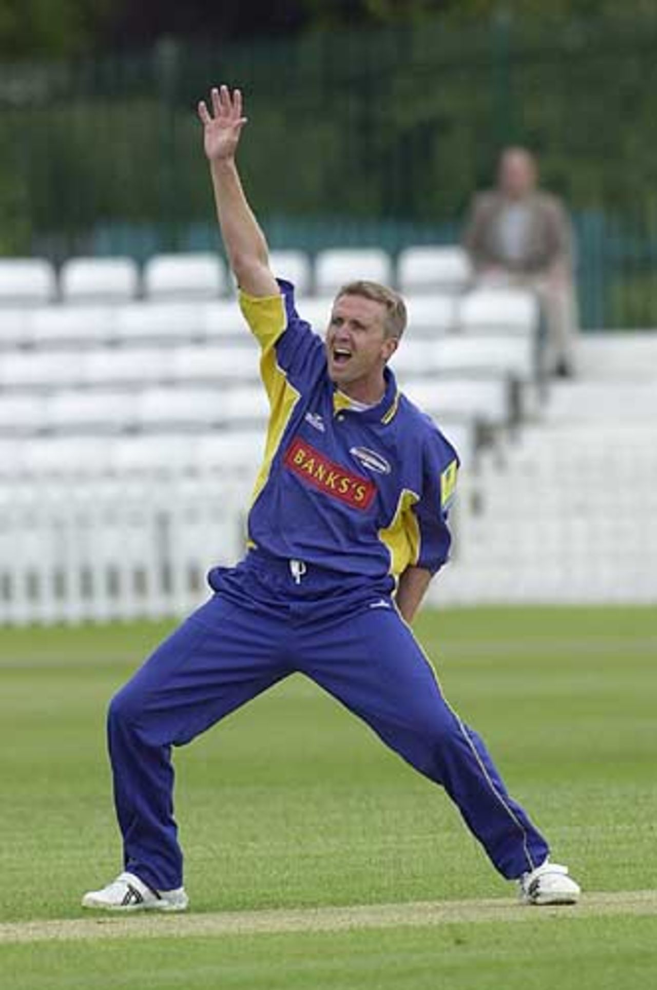 Dominic Cork in familier pose, Derby v Lancashire 23rd June 2002