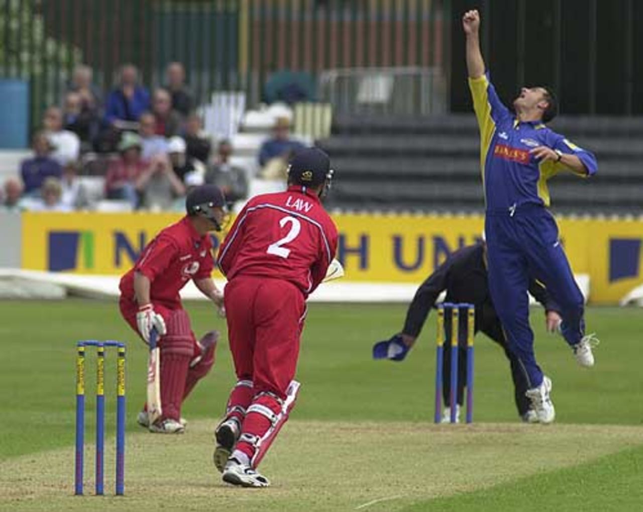 Bowler Jason Kerr tips the ball up from Stuart Law and catches it for a caught and bowled, Derby v Lancashire 23rd June 2002
