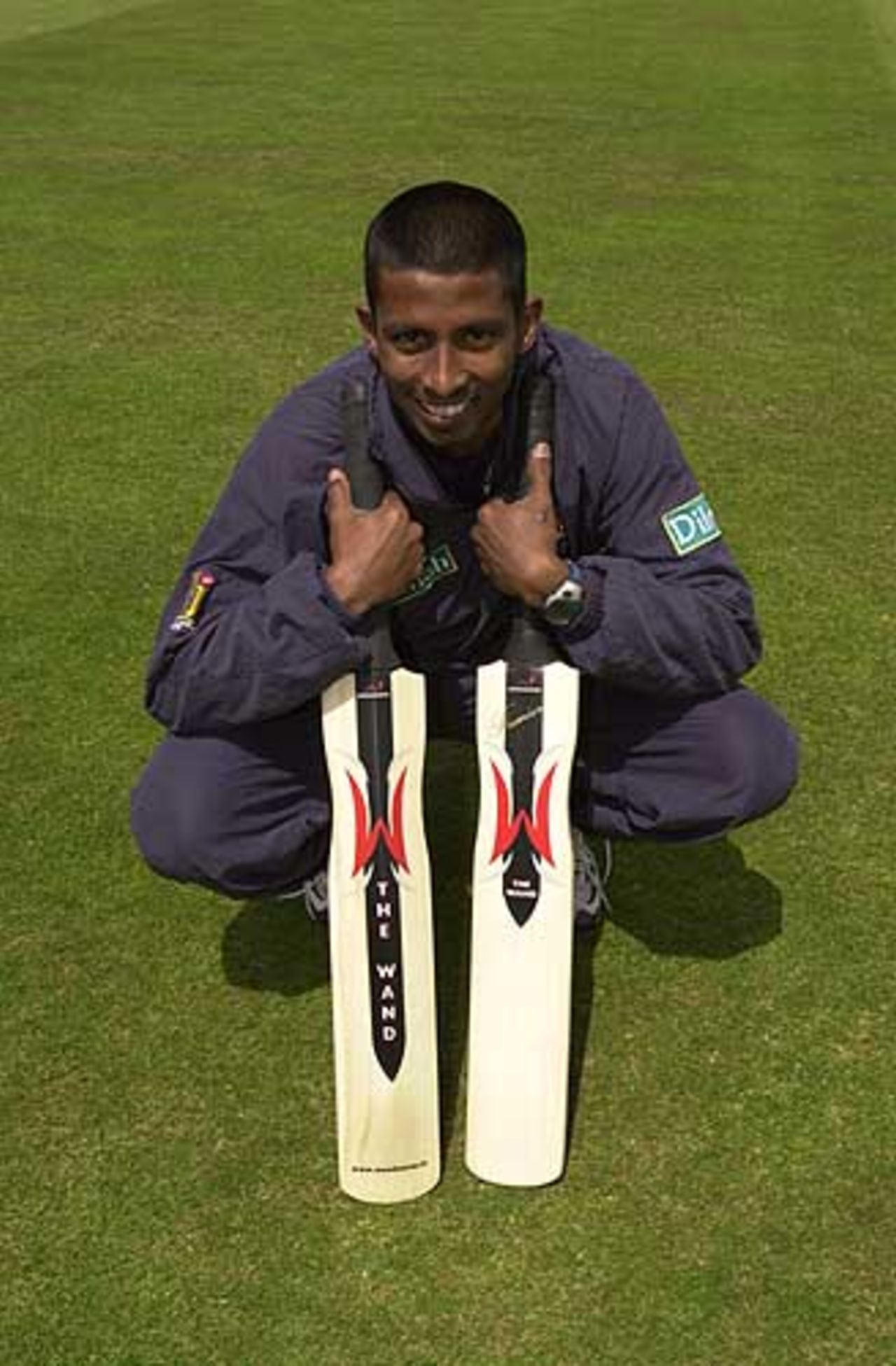 Russel Arnold pleased to demonstrate his new Woodworm Wand, Northamptonshire v Sri Lankans, June 2002