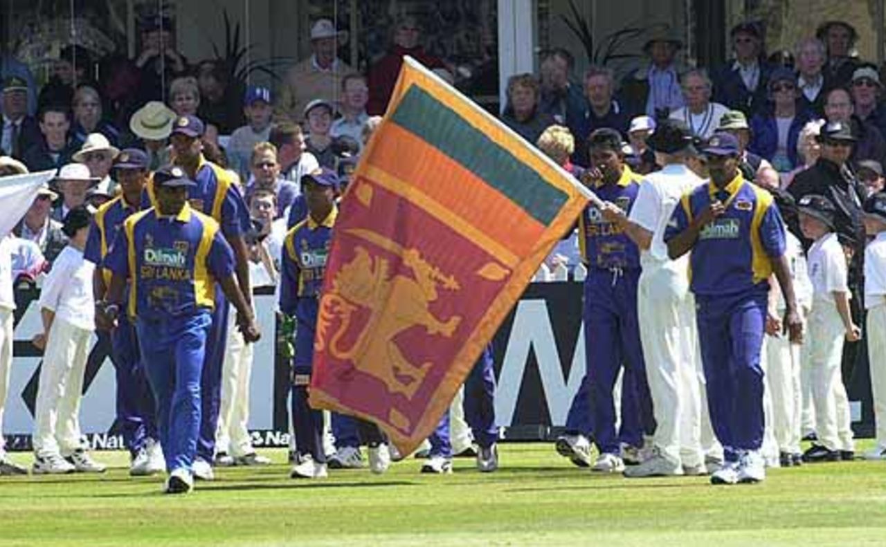 The Sri Lankan team emerge at Trent Bridge to the swirl of their national flag, England v Sri Lanka at Trent Bridge