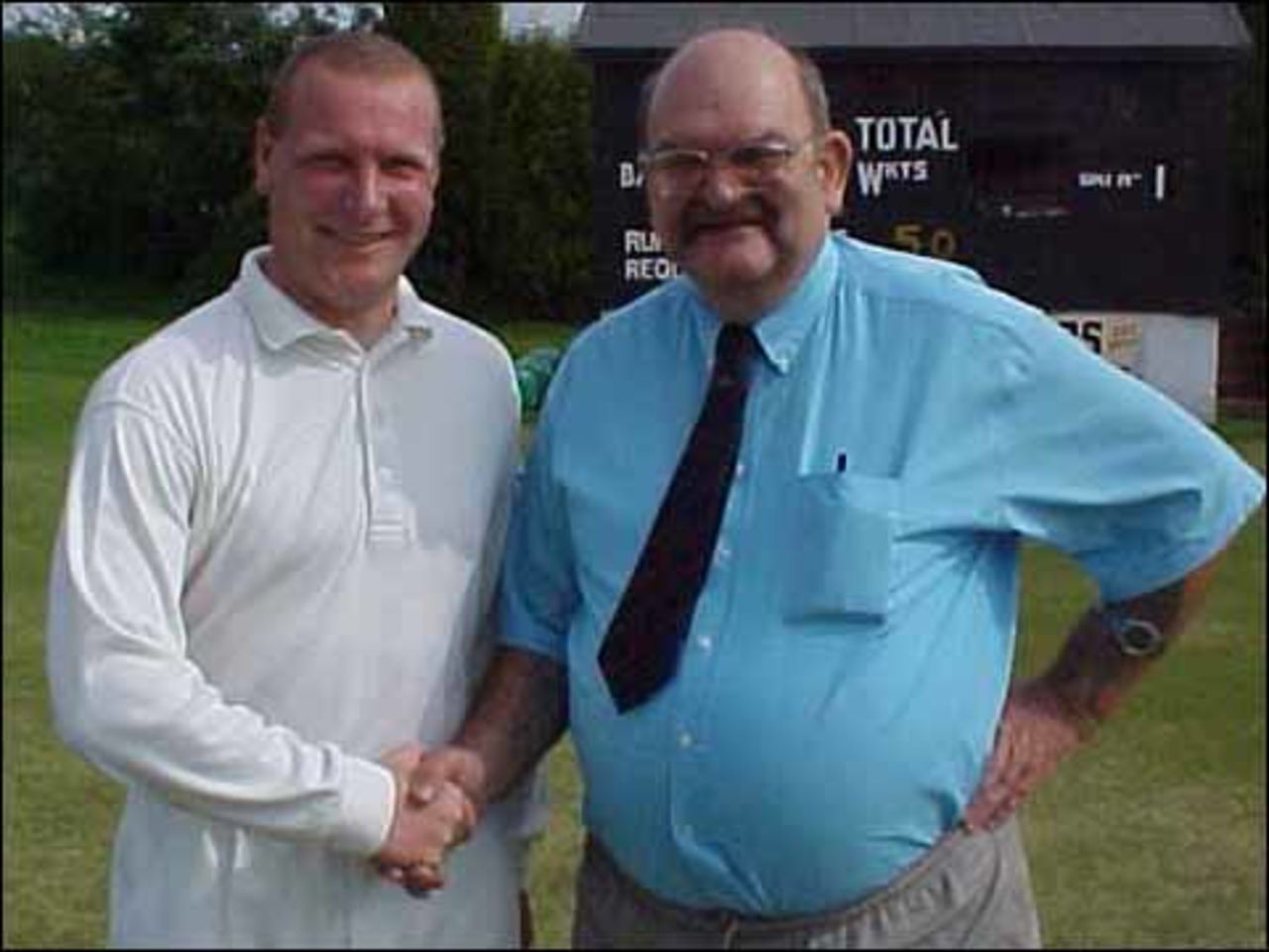 Lancashire League Secretary Lionel Cooke congratulates Chris Bleazard on scoring his 10,000th Lancashire League run for Lowerhouse in his innings of 106 not out at Accrington on June 7th