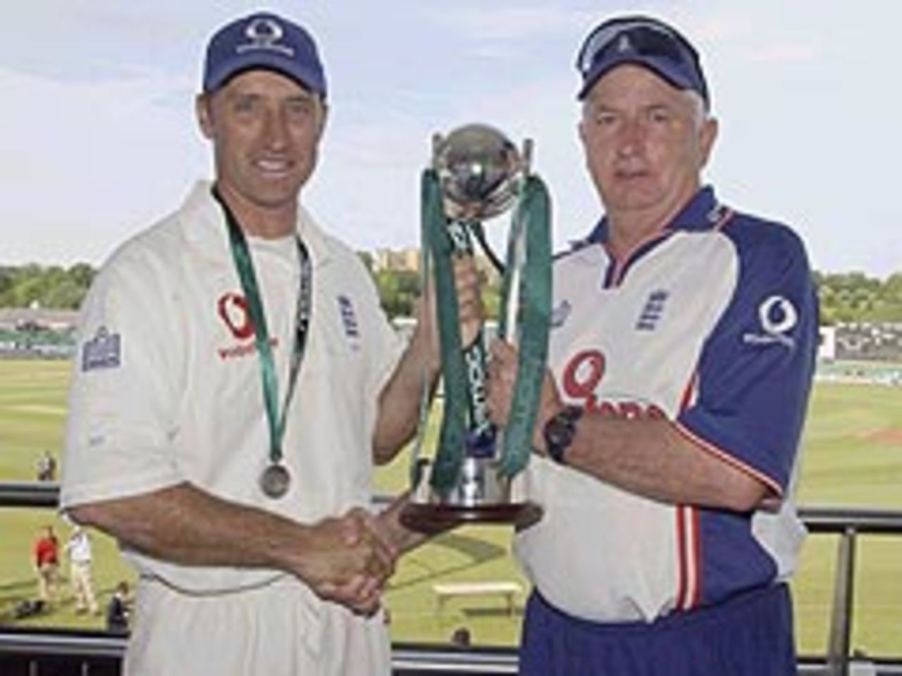 The first spoils of summer: Nasser Hussain and Duncan Fletcher pose with the npower Trophy