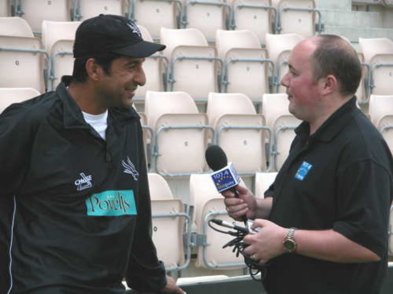 Wasim Akram shares a joke with South City FM reporter covering the forthcoming Twenty20 Cup