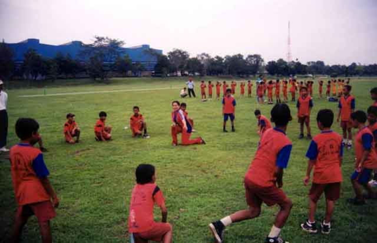 Teachers coaching children in Jakarta