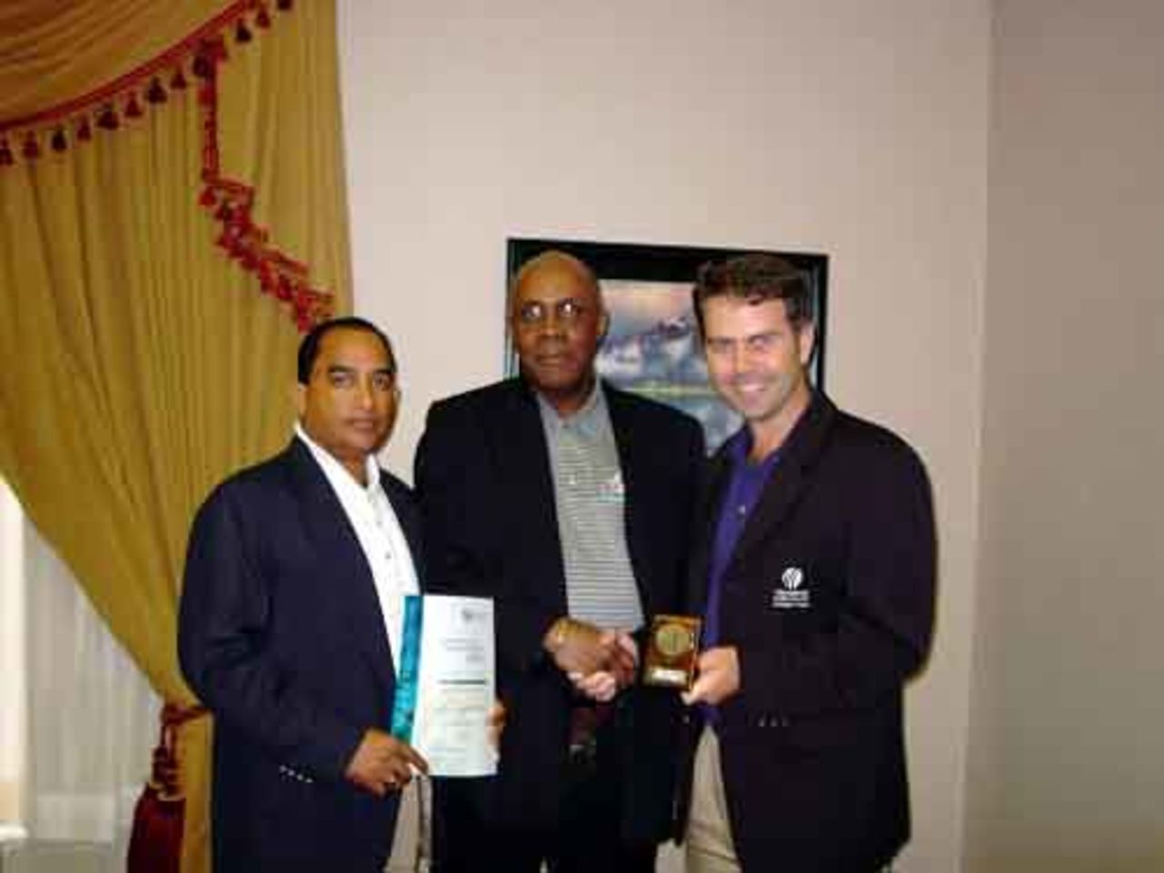 Geoff Edwards collects award on behalf of Alberta Schools Cricket Association