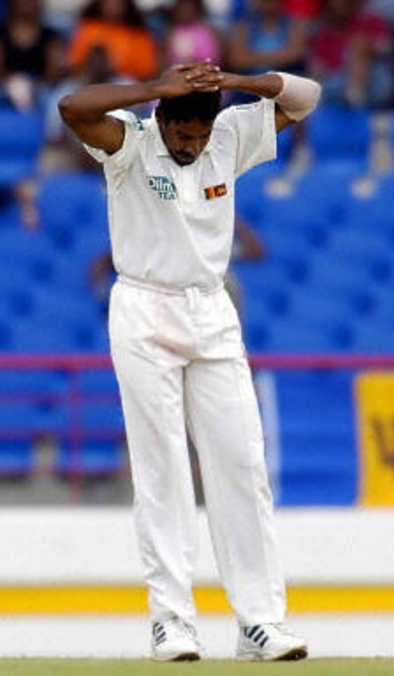Chaminda Vaas shows disappointment against West Indies' captain Brian Lara LBW on the third day of the first test match at St Lucia.