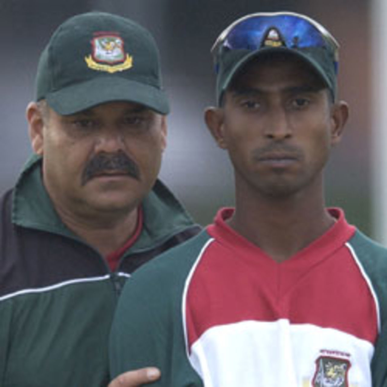 BRISBANE, AUSTRALIA - JUNE 24: Dav Whatmore, coach and Tapash Baisya of Bangladesh look on during the Bangladesh cricket team's training session June 24, 2003 at Allan Border Field in Brisbane, Australia. They are in Australia to prepare for a two test series against Australia.