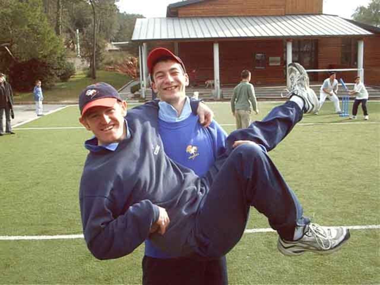 French coaches Jean-Francois Defez (standing) and David Bordes (being carried)