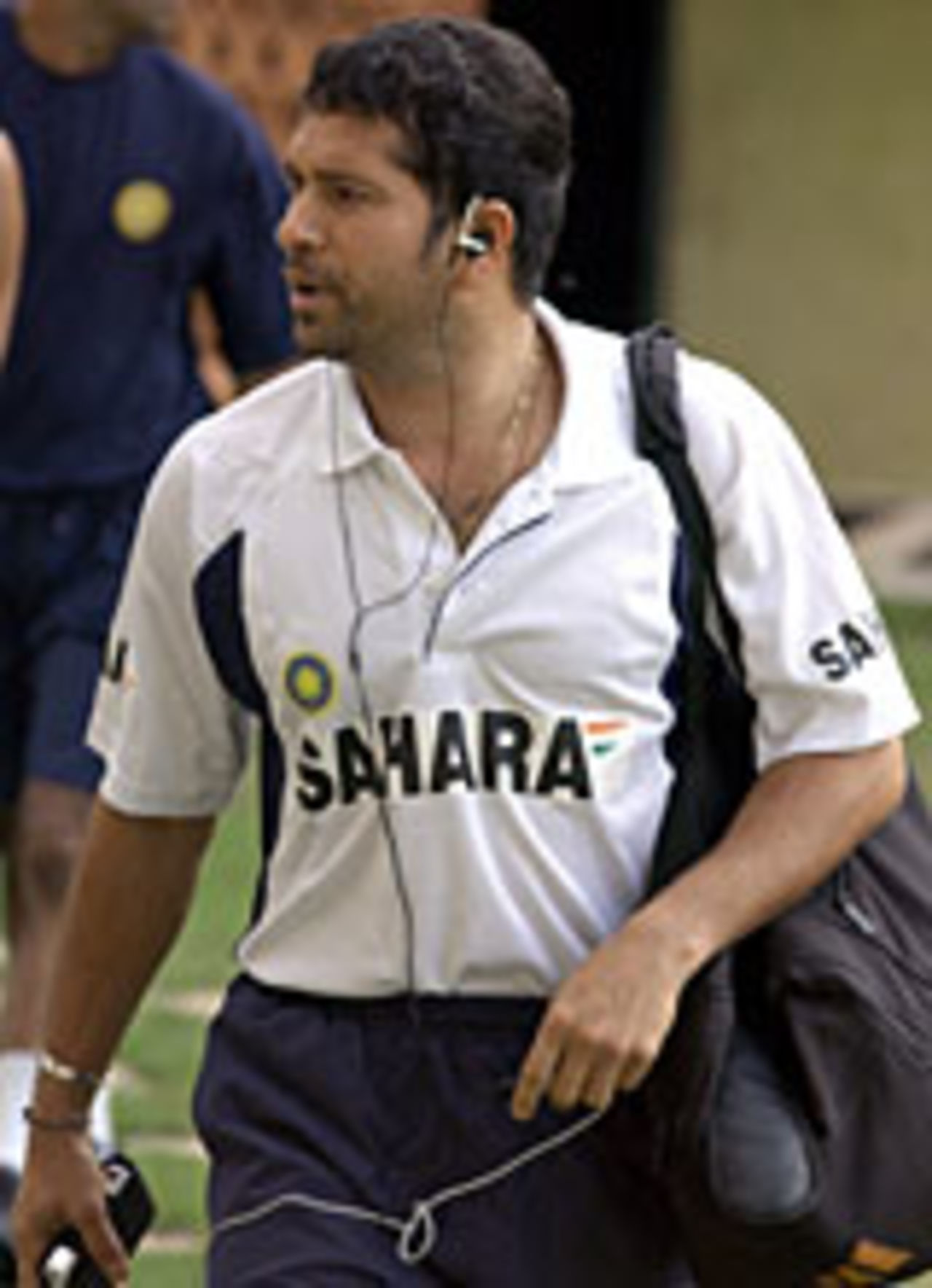 Sachin Tendulkar arrives for the second day of a combined fitness camp at the National Cricket Academy in Bangalore, June 14, 2004